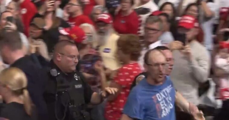“really-unattractive”-leftist-gets-clocked-after-screaming-at-trump-at-rally-–-trump-calls-supporter-“evander-‘the-real-deal’-holyfield”-–-crowd-roars!-(video)