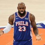 king-james-practices-his-golf-swing-while-the-national-anthem-plays