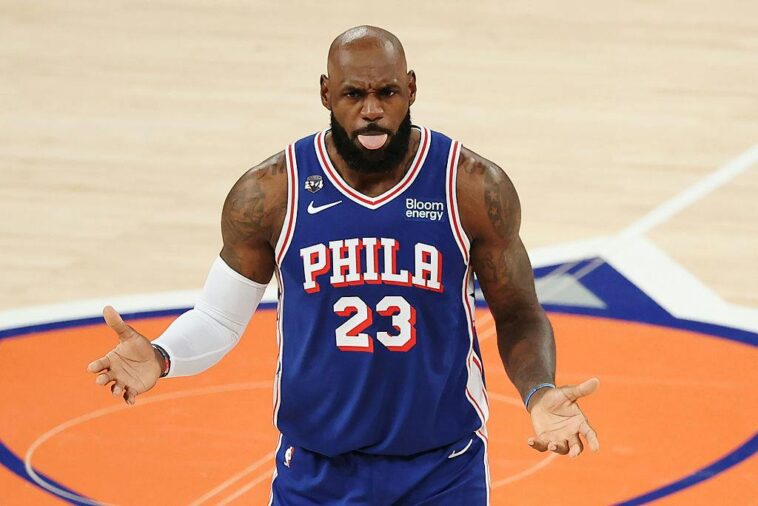 king-james-practices-his-golf-swing-while-the-national-anthem-plays