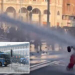 wild-moment-italian-cops-blast-young-protester-with-water-cannon-after-she-joined-far-left-rioters