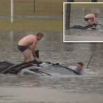 heroic-tv-reporter,-bystander-rescue-man-trapped-inside-vehicle-quickly-sinking-in-floodwaters