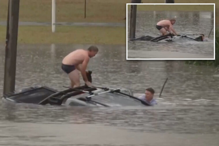 heroic-tv-reporter,-bystander-rescue-man-trapped-inside-vehicle-quickly-sinking-in-floodwaters