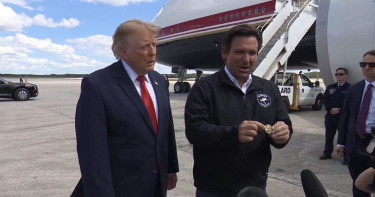 desantis-gives-trump-a-custom-gold-coin-engraved-with-trump-flipping-the-bird-and-“you-missed-b*tches”-(video)