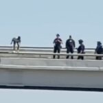 tragic-video:-man-jumps-to-his-death-from-dallas-highway-bridge-after-hours-long-swat-standoff-—-police-unable-to-save-him-as-horrified-officers-look-on