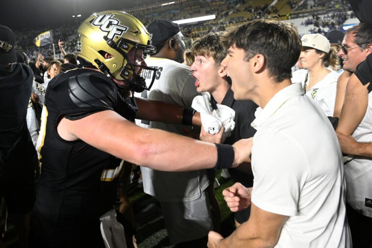 ucf-survives-late-controversy,-knocks-off-no.-2-byu-in-ot-as-fans-storm-field-in-wild-scene