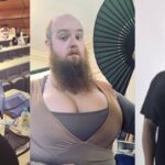 bearded-oxford-lecturer-teaching-biochemistry-while-wearing-giant-prosthetic-breasts,-and-the-university-shrugs